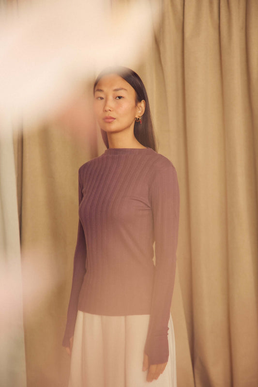 Cocoa Lyocell Ribbed Long Sleeve Top on a model against a light background showcasing its fine ribbed texture.