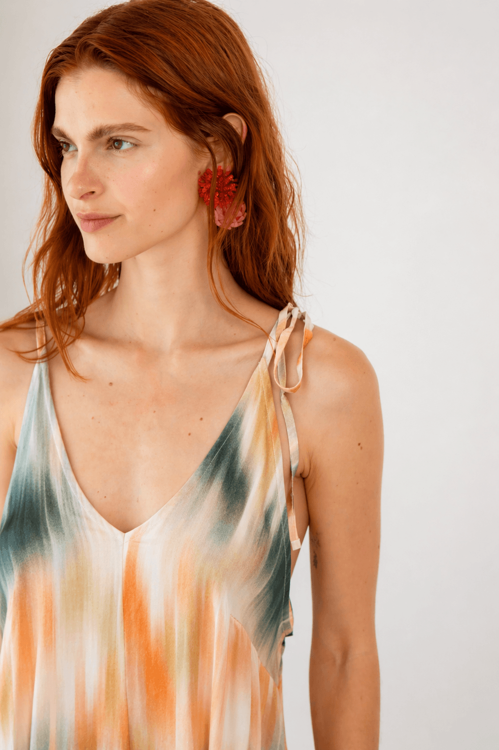 Model wearing Printed Ecovero Viscose Maxi Dress, featuring adjustable shoulder straps and vibrant seasonal print.