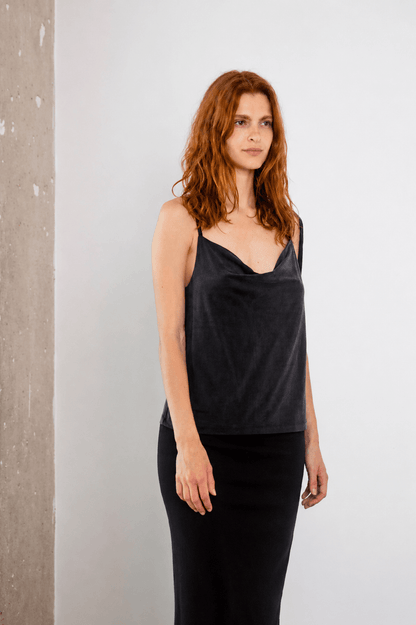 Cupro Drape Slip Top in Slate Black worn by a model with flowing hair, featuring a draped neckline.