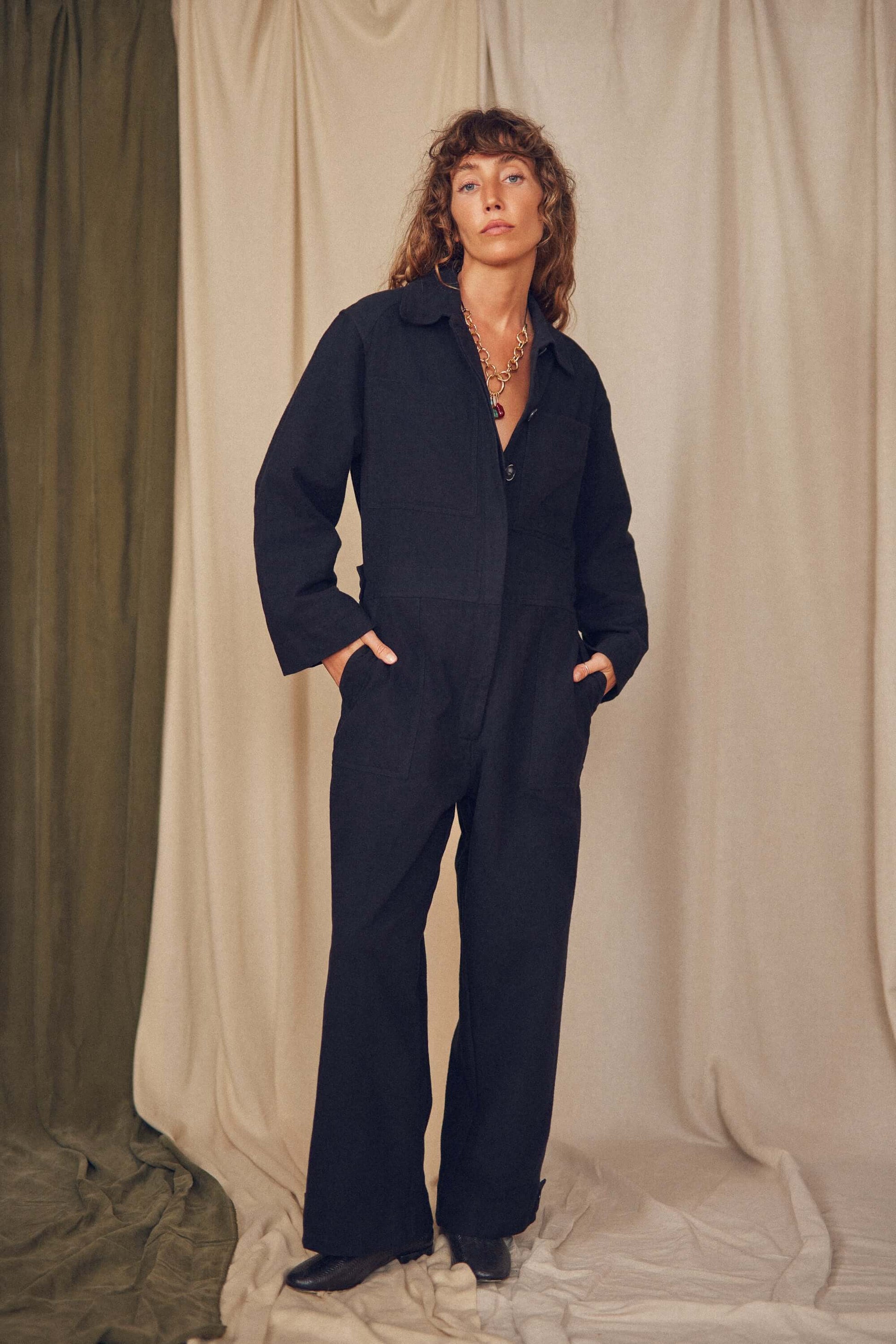 Model wearing the Rust Organic Cotton Boiler Suit, showcasing comfort and style with eco-friendly design.