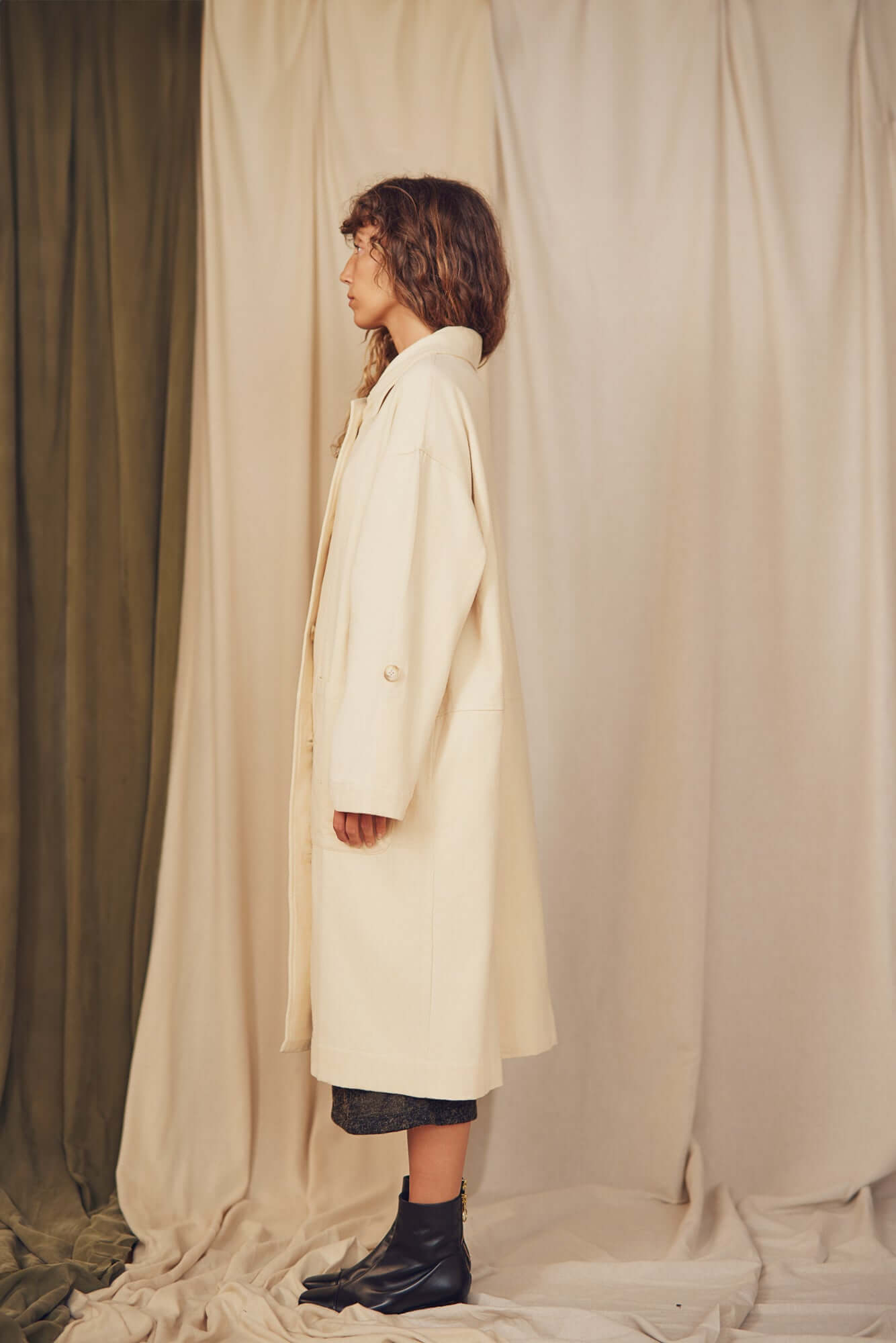 Model showcasing the Oat Organic Cotton Long Wide Coat from the COSSAC Autumn/Winter collection.