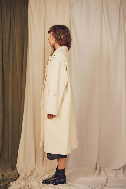 Model showcasing the Oat Organic Cotton Long Wide Coat from the COSSAC Autumn/Winter collection.