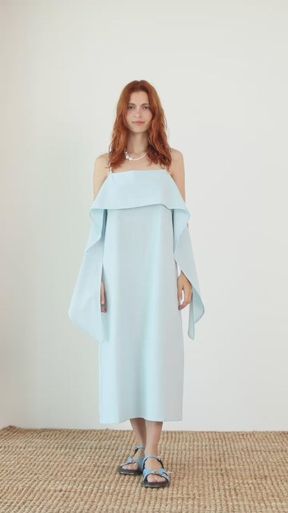 Organic Cotton Sun Dress with Front Frill in Pale Blue worn by a model, showcasing a relaxed daytime silhouette.